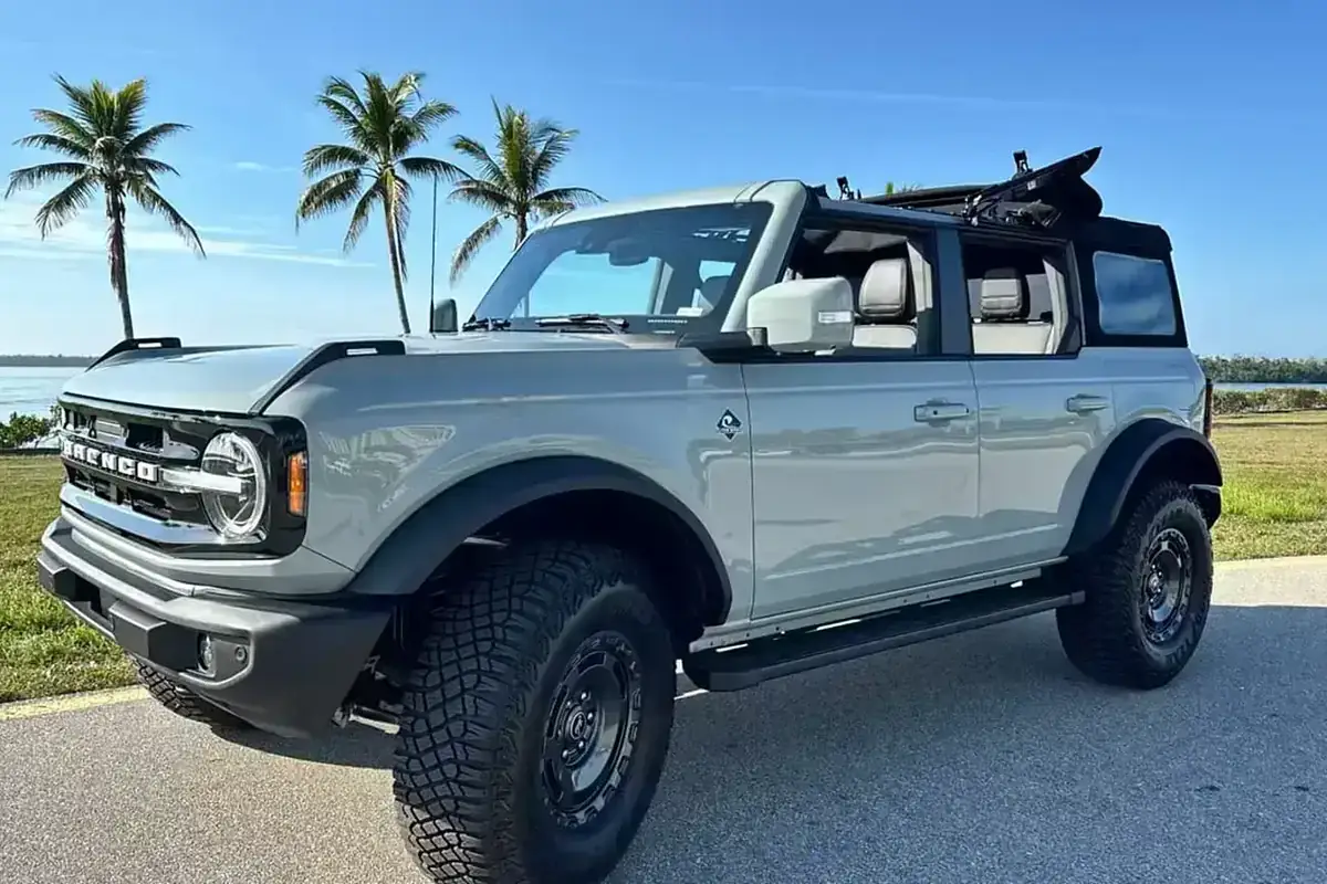 A Ford Bronco from the SWFL Auto Rentals fleet parked by the water in Southwest Florida